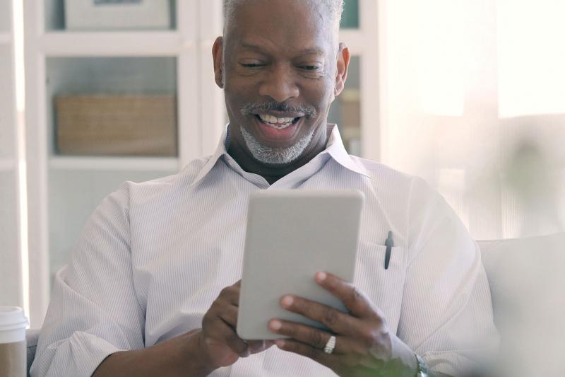 Man on a video call with his physician.