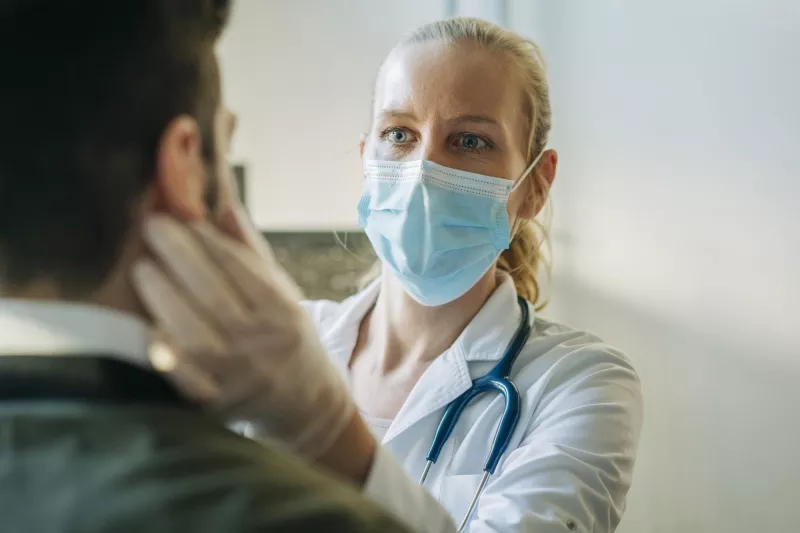Female physician with patient