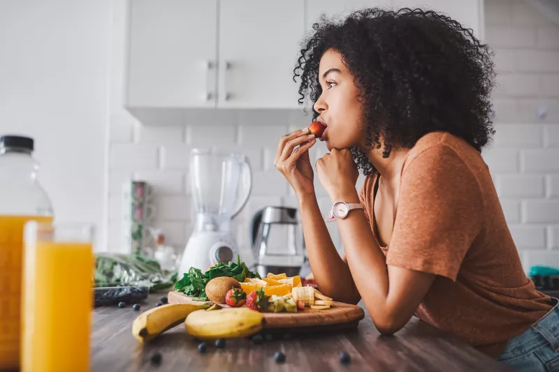 A woman eating healthy.