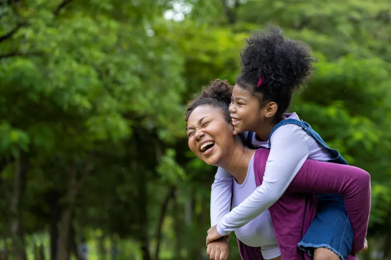 Mother and daughter enjoying the park together