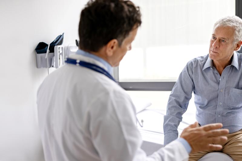 Man talking to his doctor about his heart