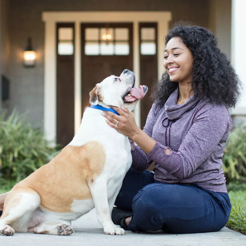 Woman playing with her dog.