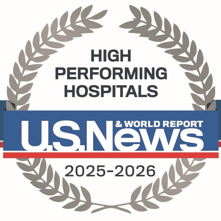 Emblem that represents high performing in several categories by US News & World Report