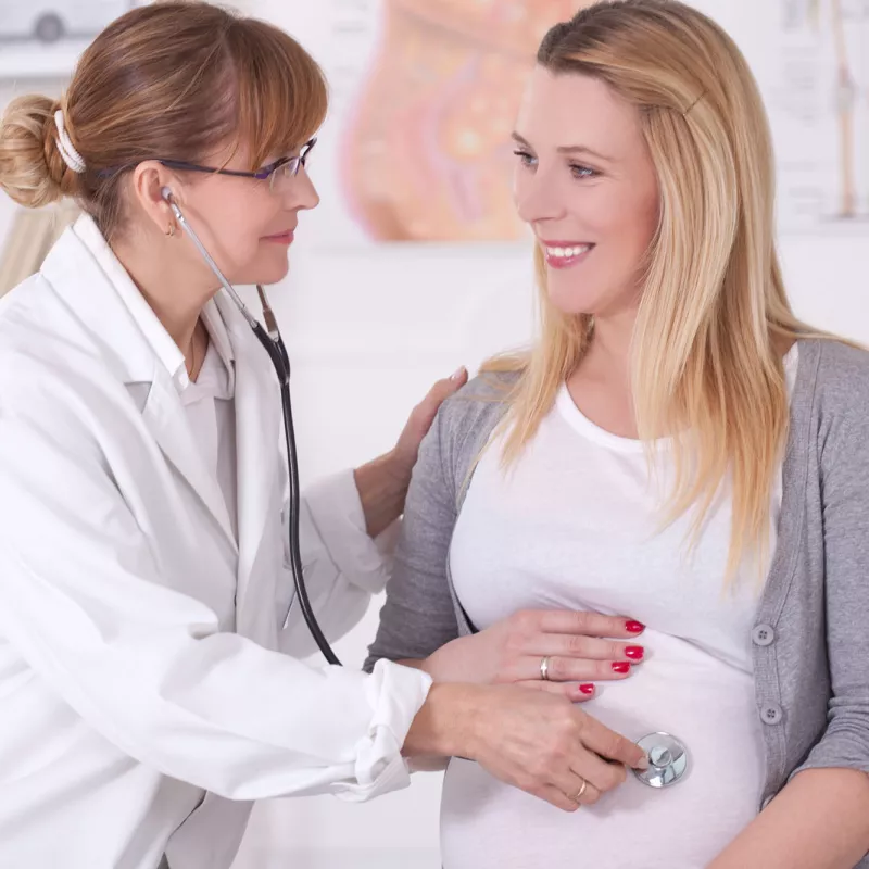 A pregnant woman at the doctor.