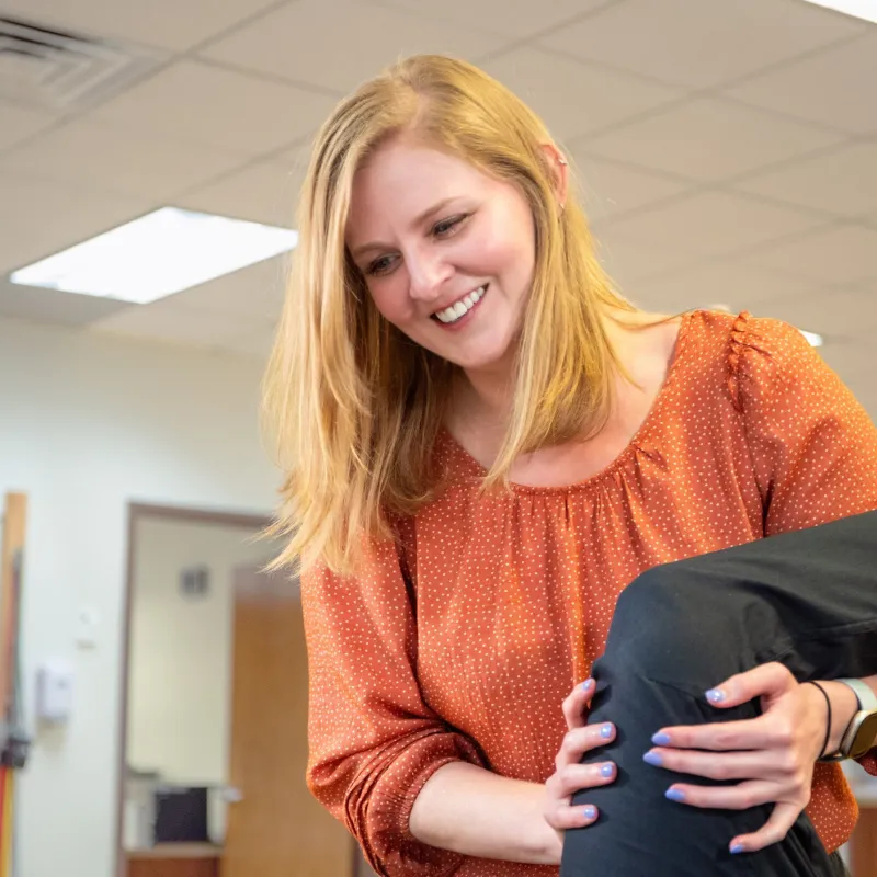 Therapist at Texas Health Huguley Hospital caring for patient