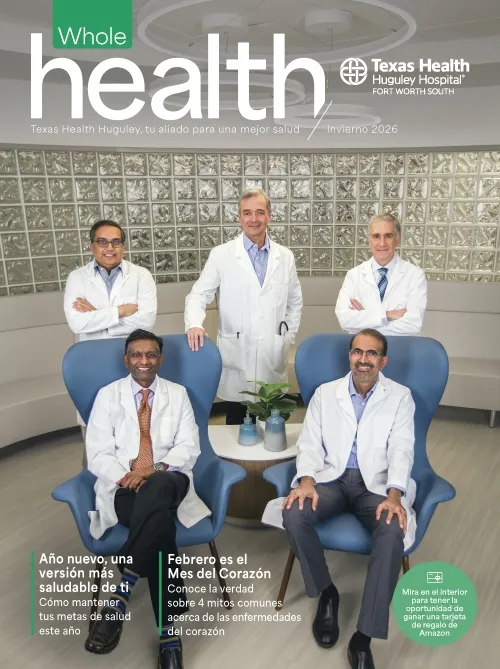 5 doctors together inside the hospital with their white coats on