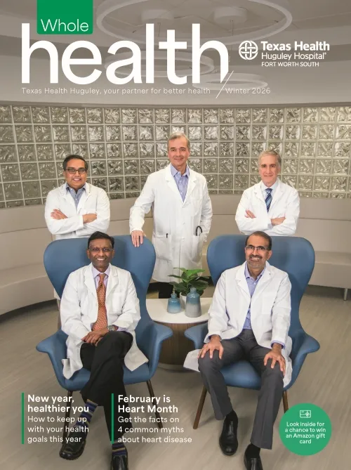 5 doctors together inside the hospital with their white coats on